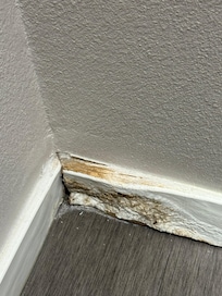 Behind the bathroom door. It smells really bad and also their AC is well too