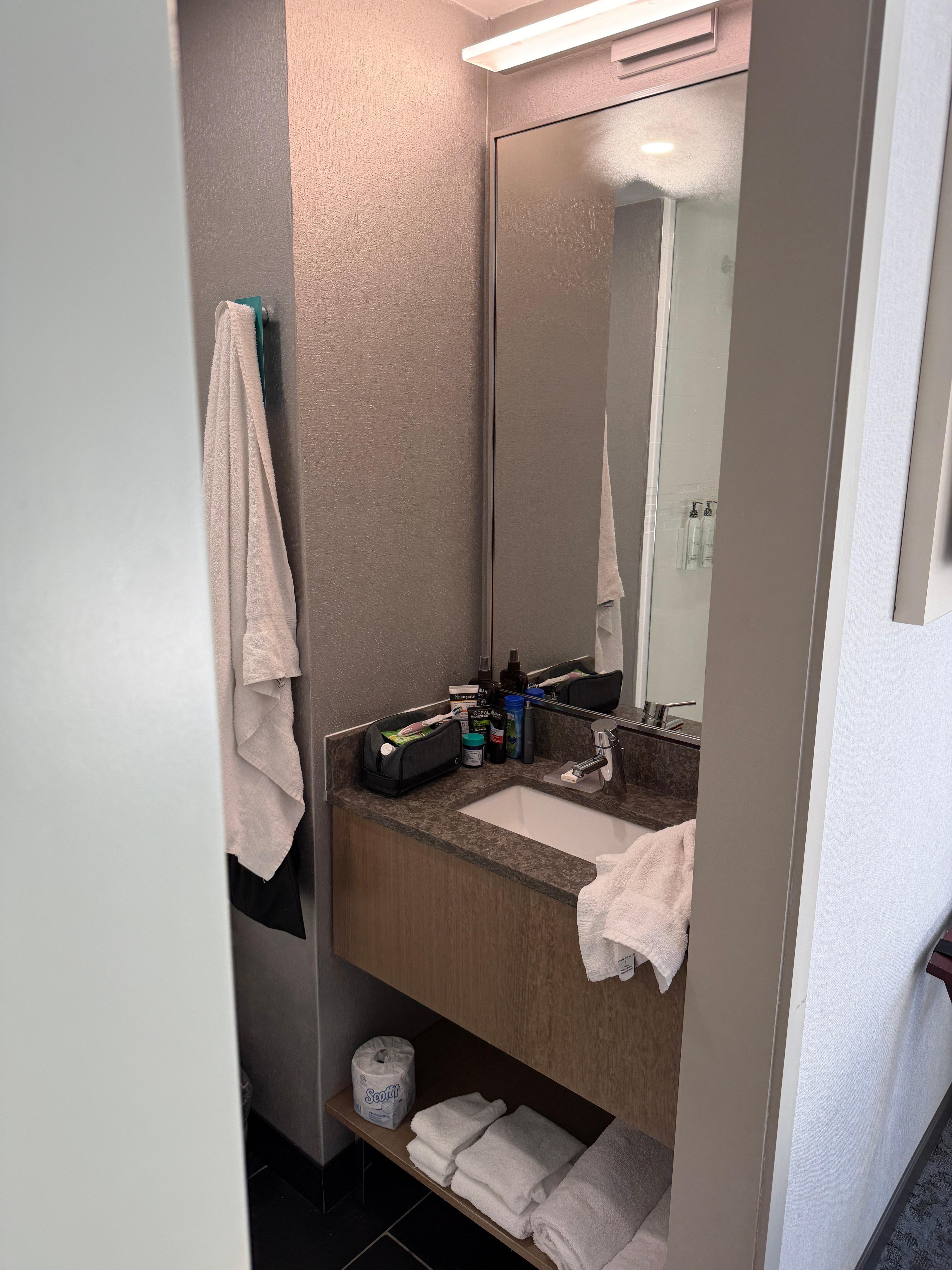 Shower, sink, toilet, fresh towels