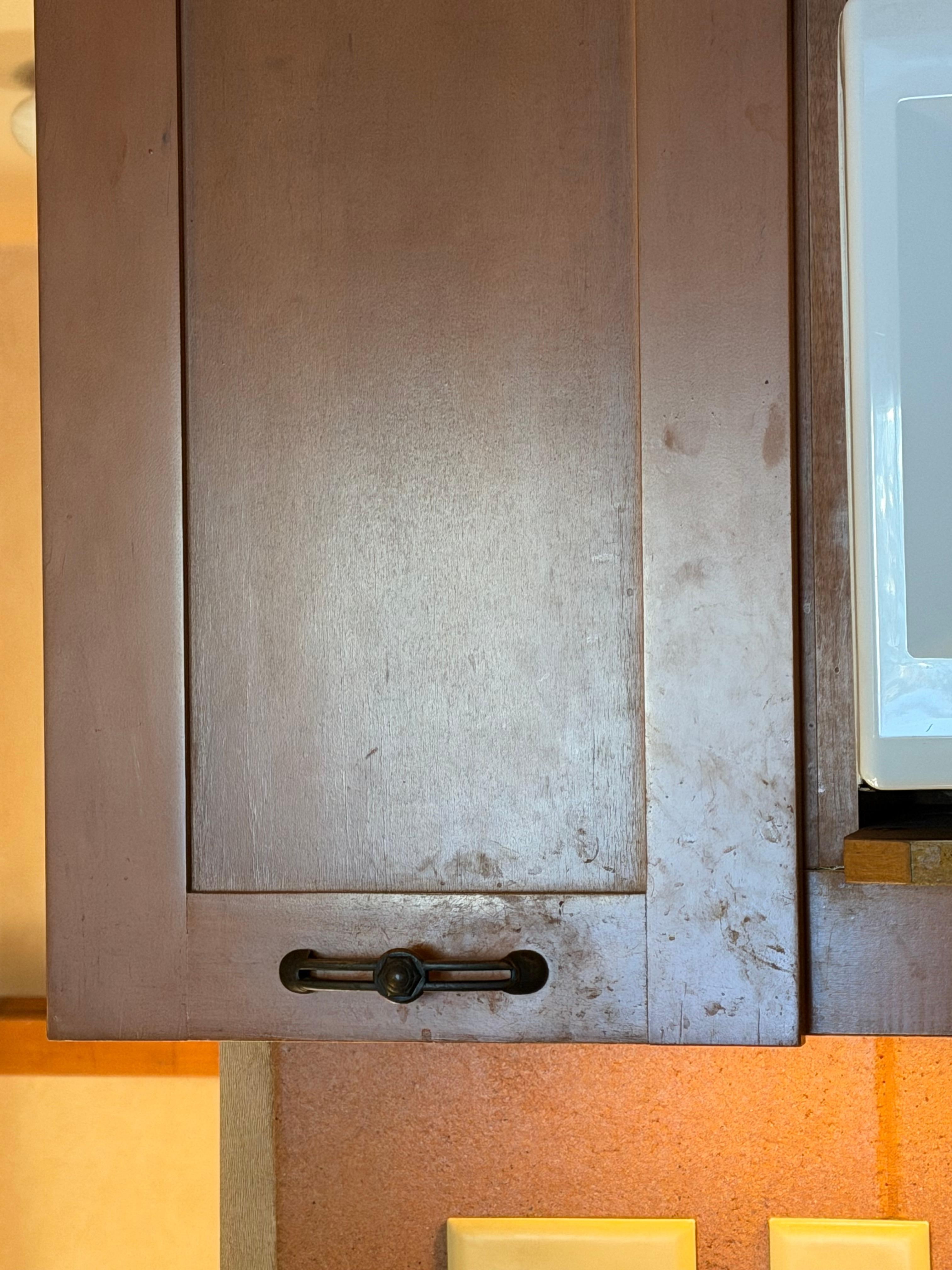 Cupboards as arrived covered in dirty handprints 