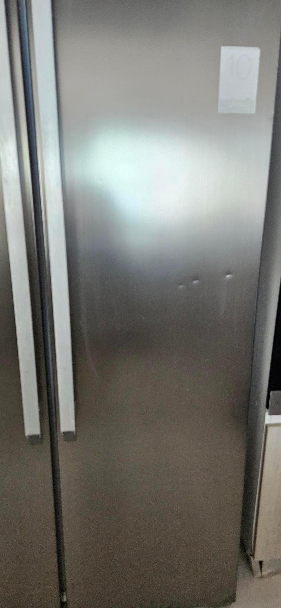 Refrigerator that  didnt work. Was dented in several places.  Displayed an error code upon our arrival. 