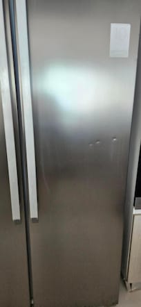 Refrigerator that didnt work. Was dented in several places. Displayed an error code upon our arrival.