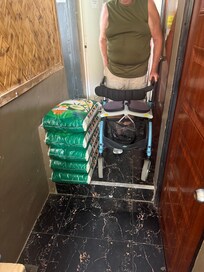 I’m standing beside the boxes blocking the hallway from the other directions