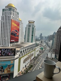 View from room while enjoying my Americano bought from coffee place at foodcourt downstairs of hotel.