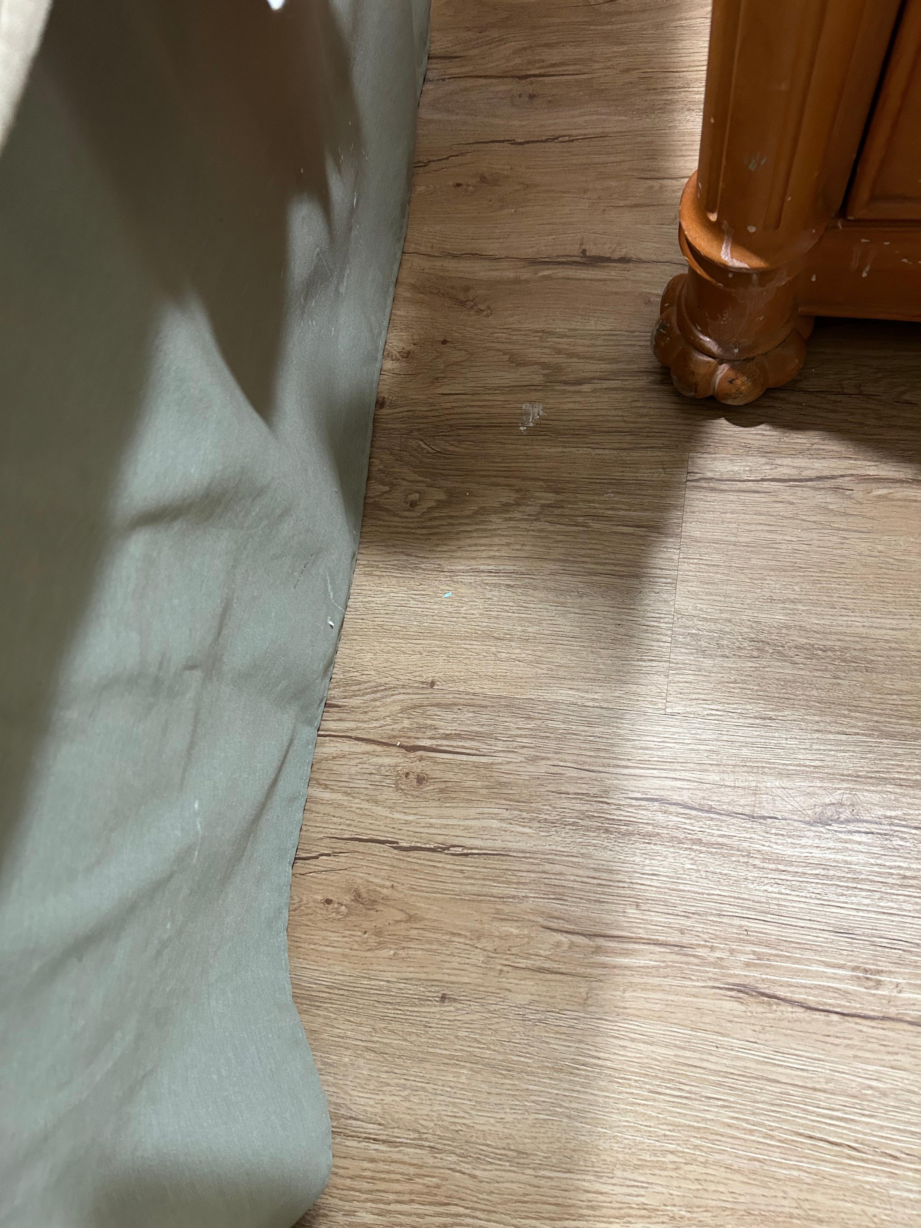 Spots of paint and dirt all over the floors and on the furniture.