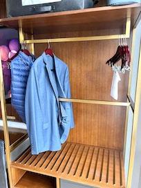 The only place to hang clothes has a metal bar through the middle — wrinkling anything that hangs there.