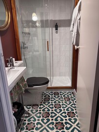 Bathroom is small. Hand held shower only.