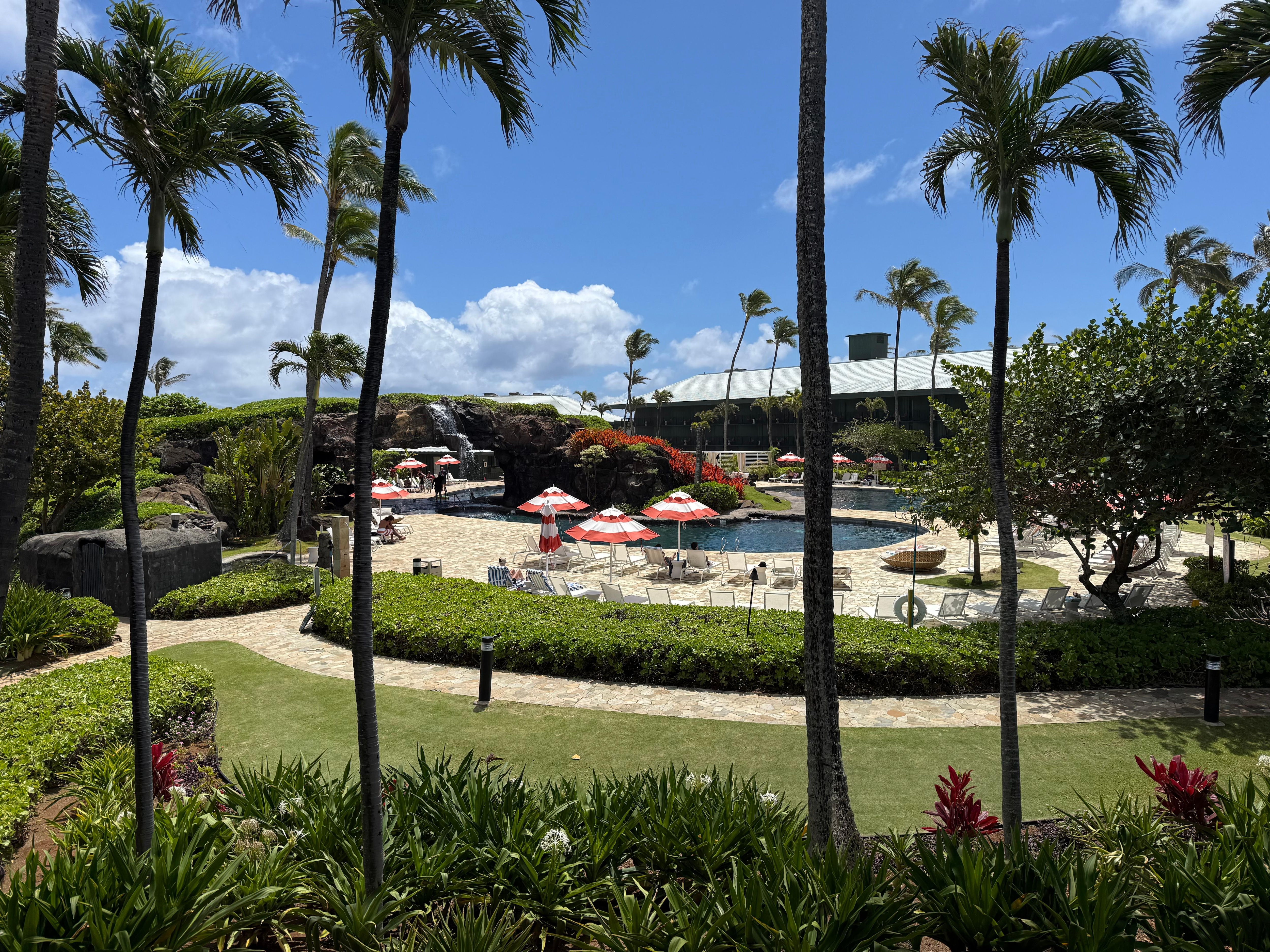 View from 2nd floor balcony (junior suite). 1 large pool with waterfall feature, jacuzzi and water slide pool along with a shallow sand bottom pool for the Keiki.  