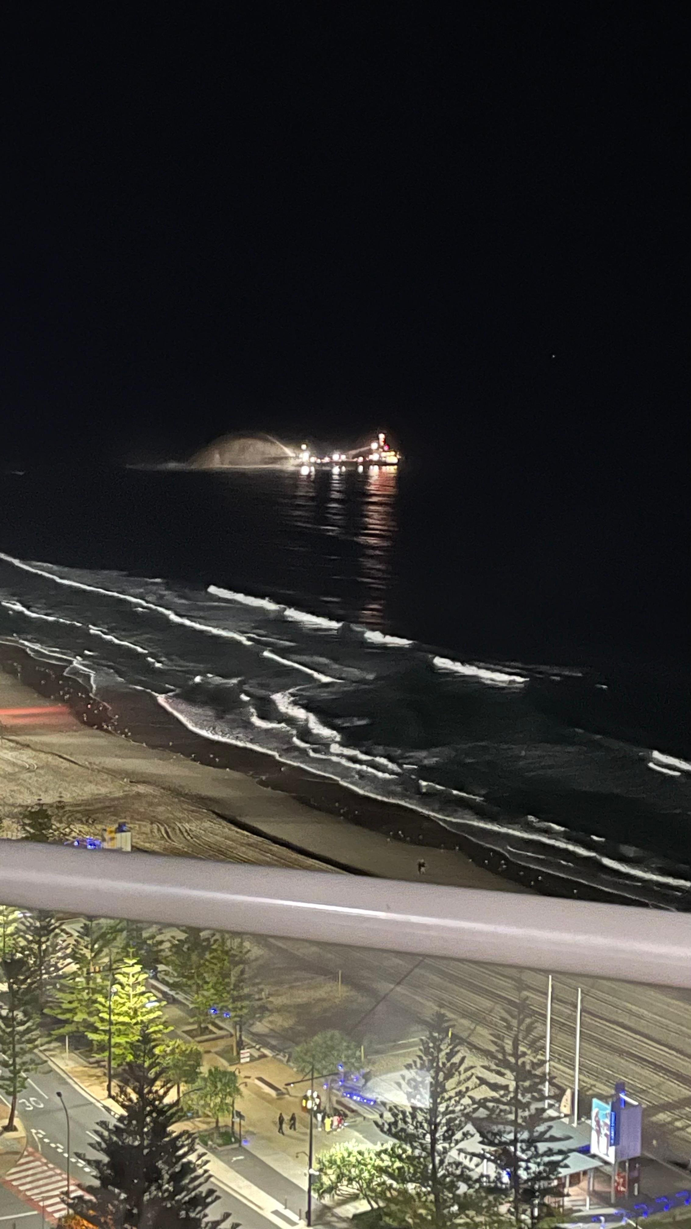 Dredging sand at night
