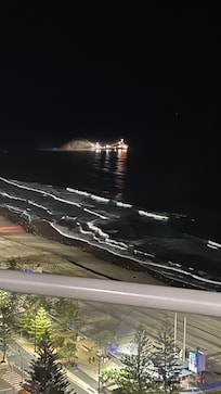 Dredging sand at night