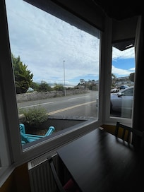 Facing a quiet road overlooking the bay