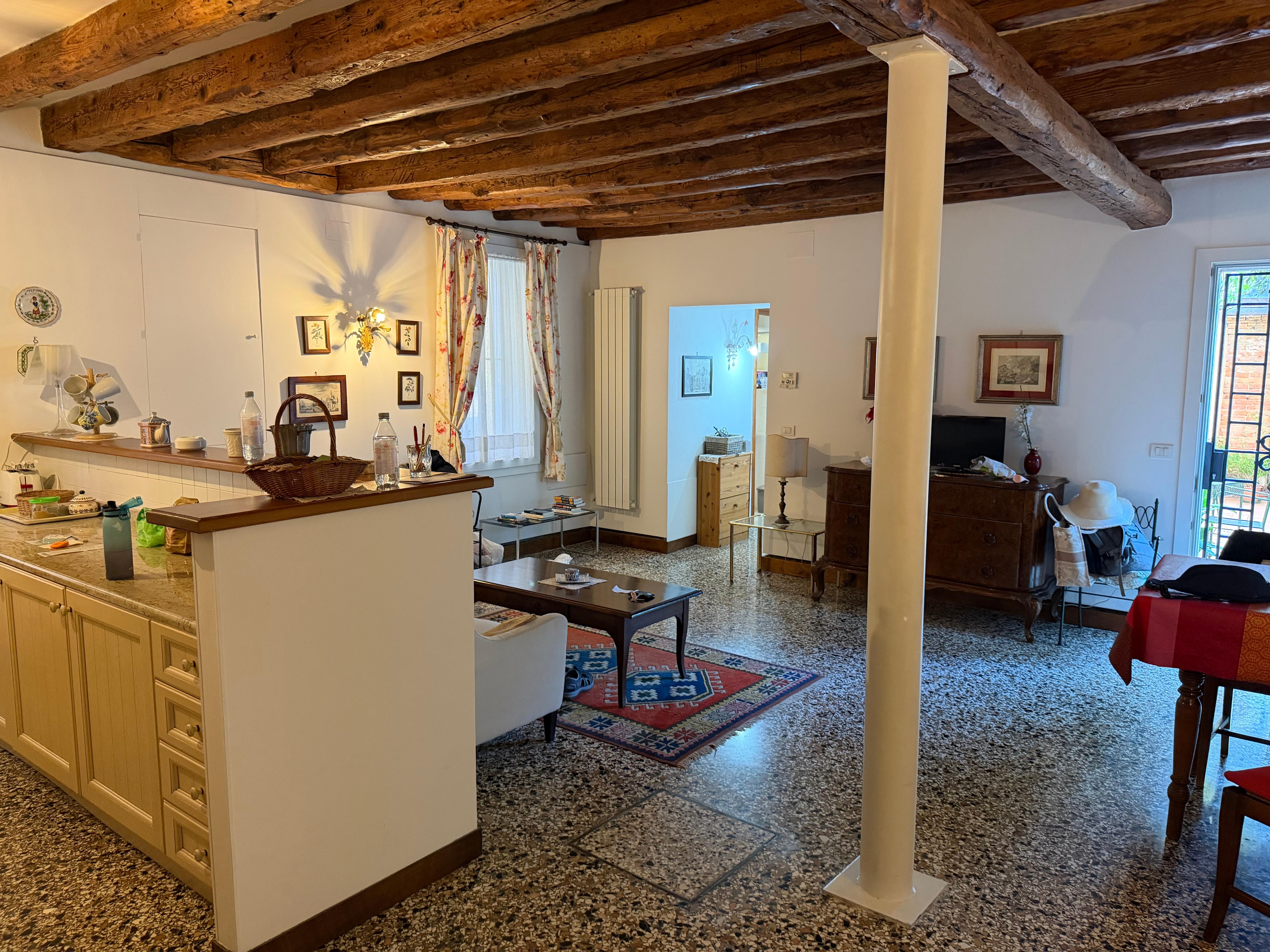 Sitting room and partial view of kitchen 