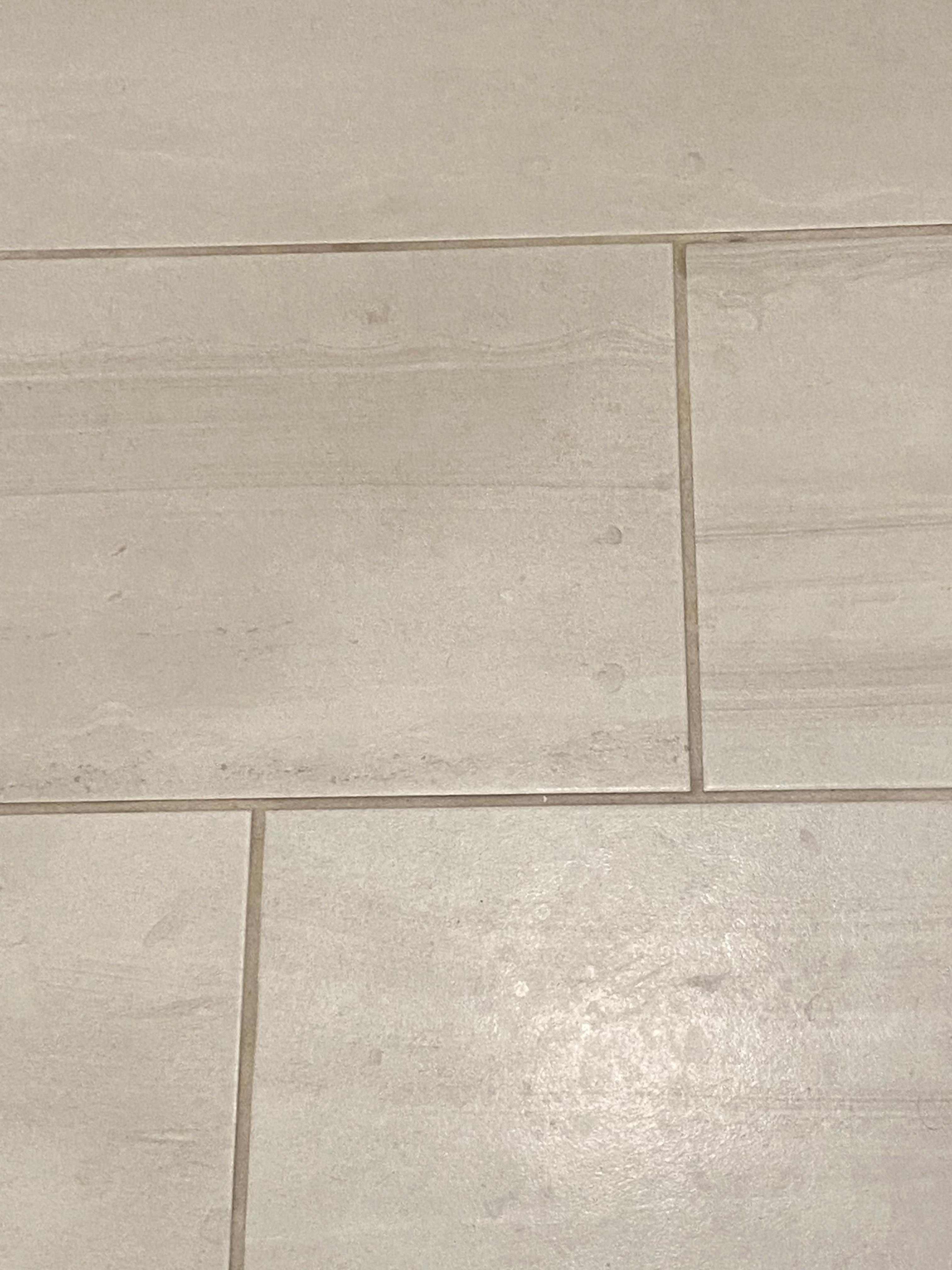 Dirt on floor. Hard to see because of floor color