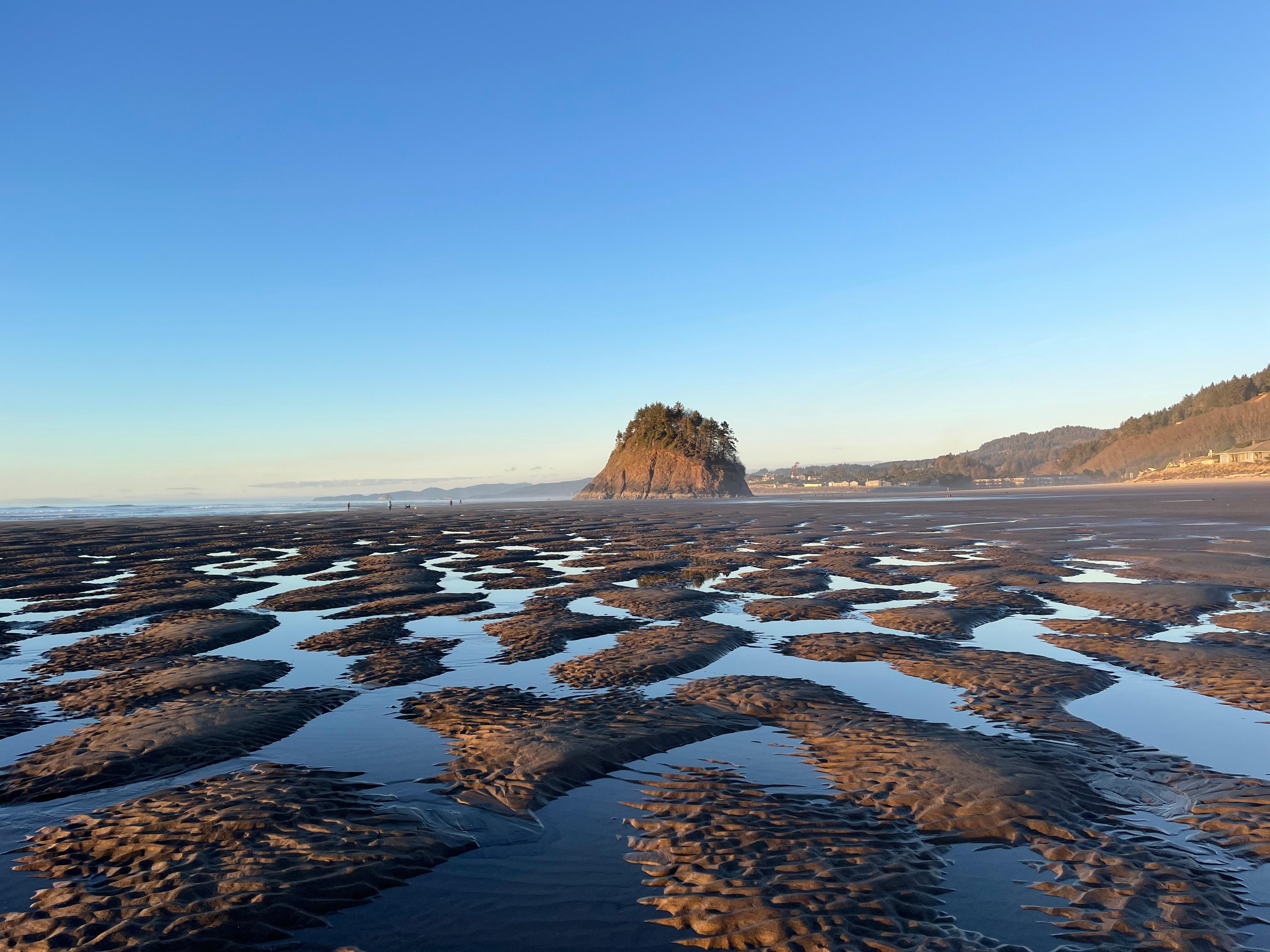 Unusual sand formations during low tide the day of a lunar eclipse.