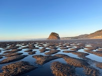 Unusual sand formations during low tide the day of a lunar eclipse.