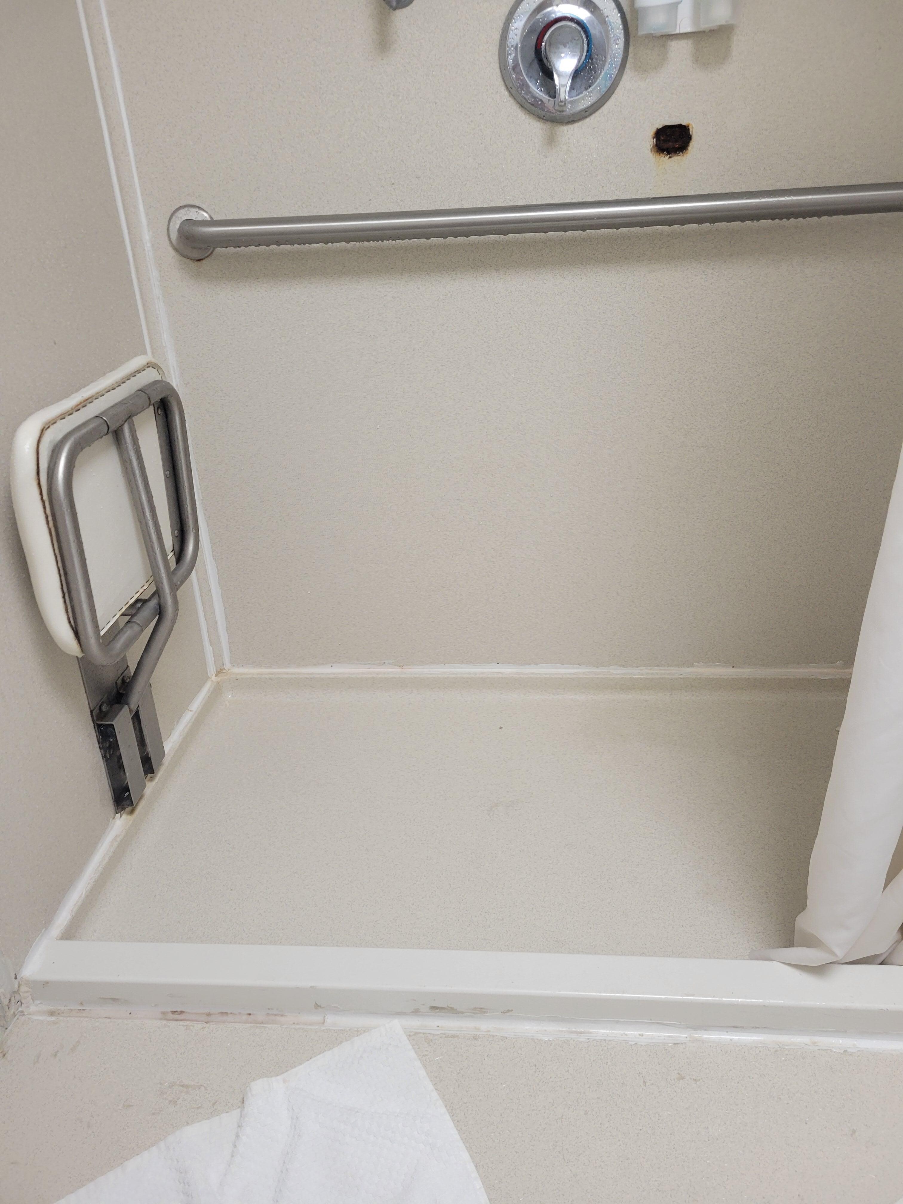 Easy to get into and has a chair.