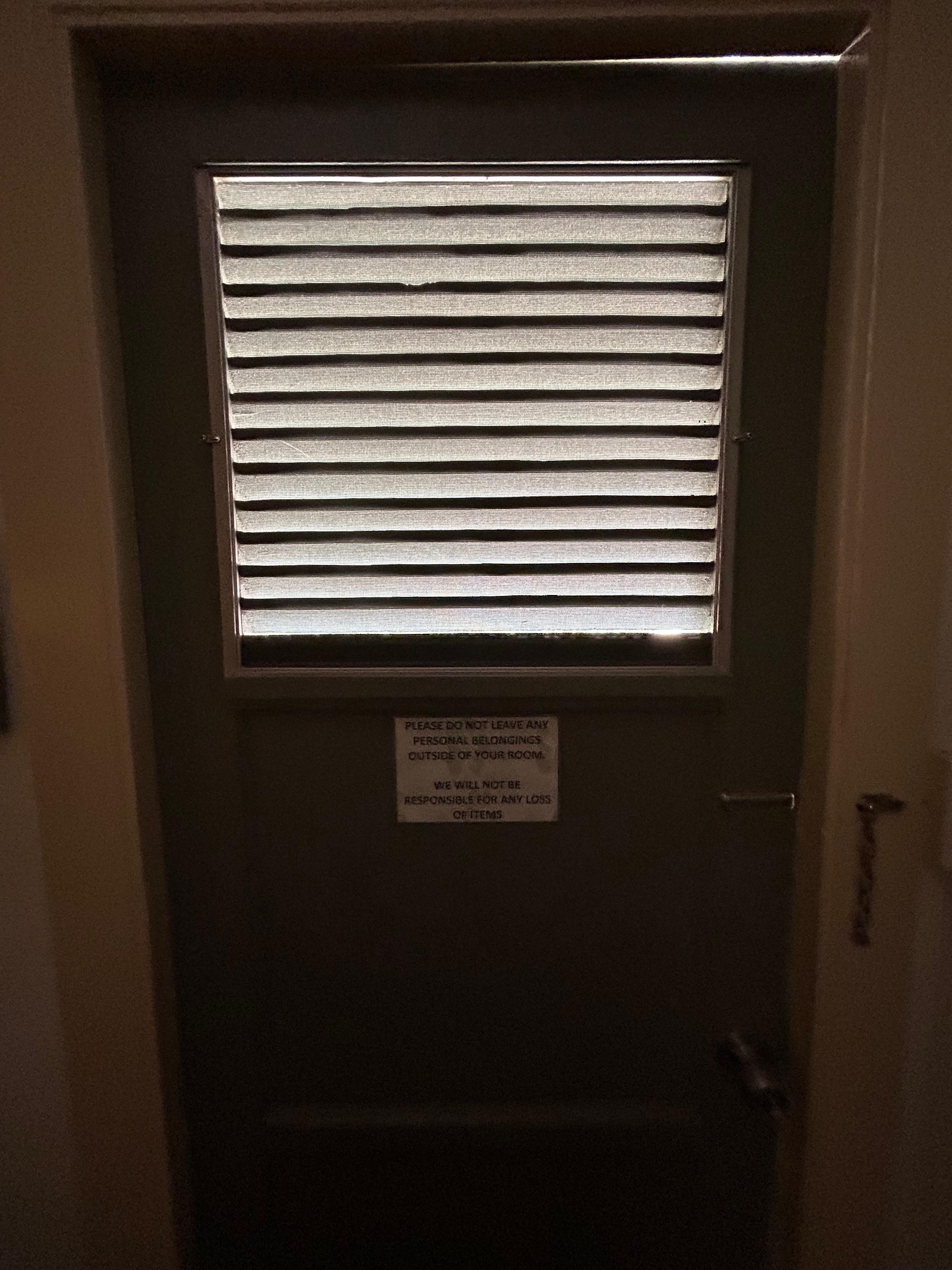 Front door. No way to dark or quiet the room.