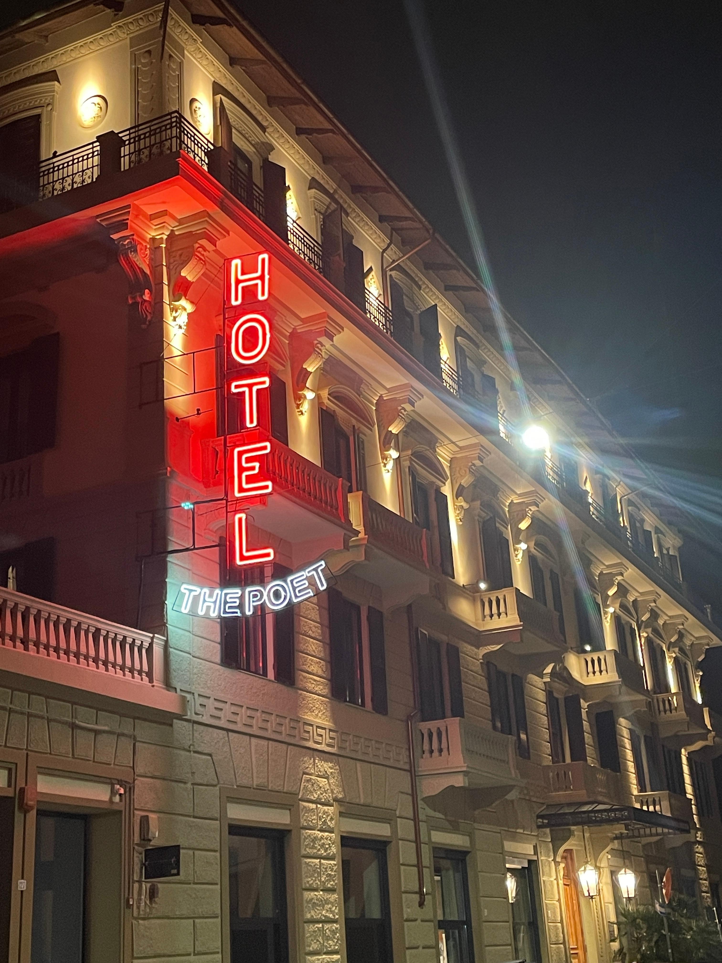 The Poet Hotel exterior by night.