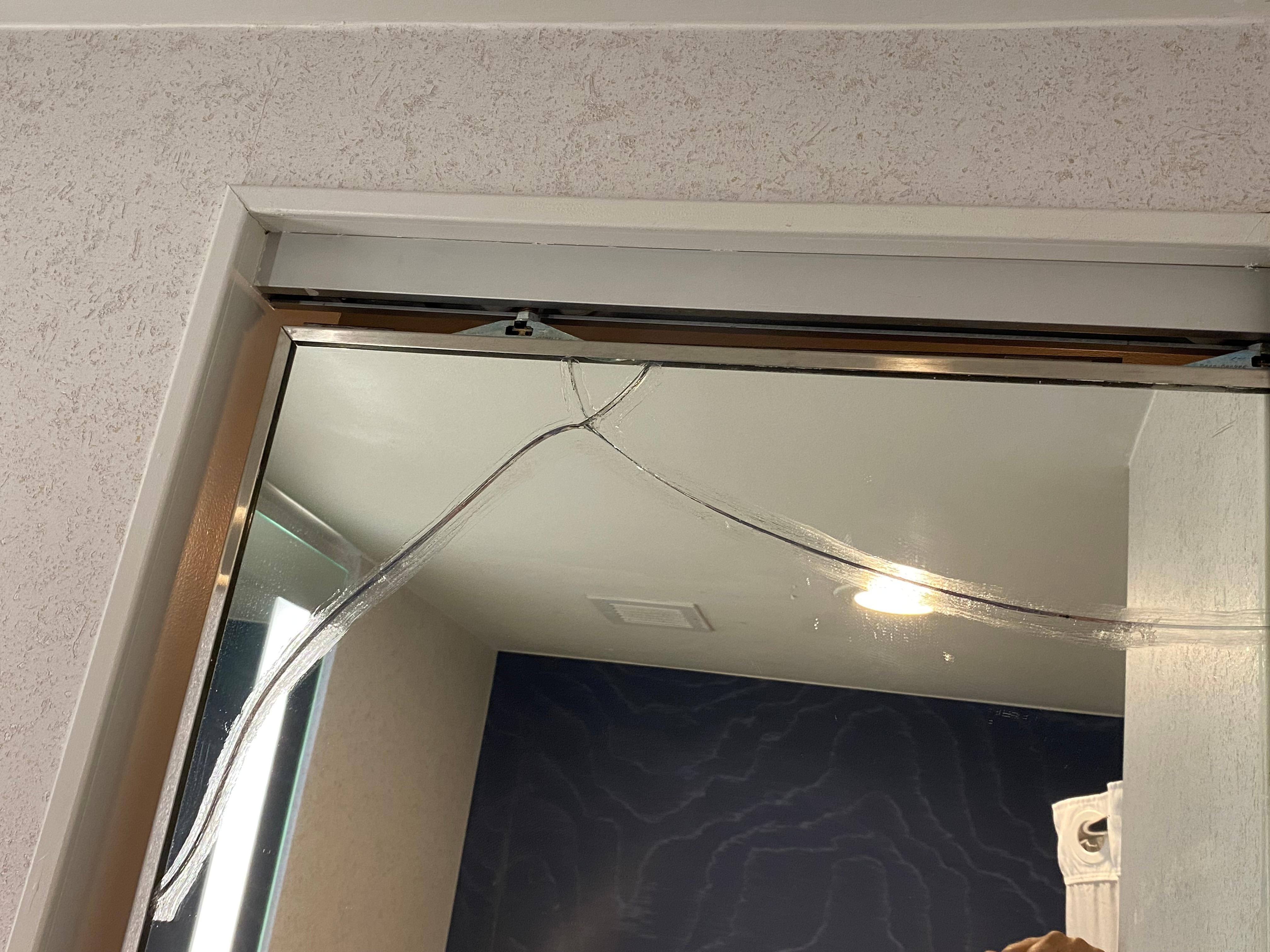 Broken sliding mirror bathroom door