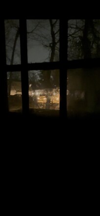 Picture of a door showing how dark the stairwell is with one of the lights not working. Iâm unable to attach the video.