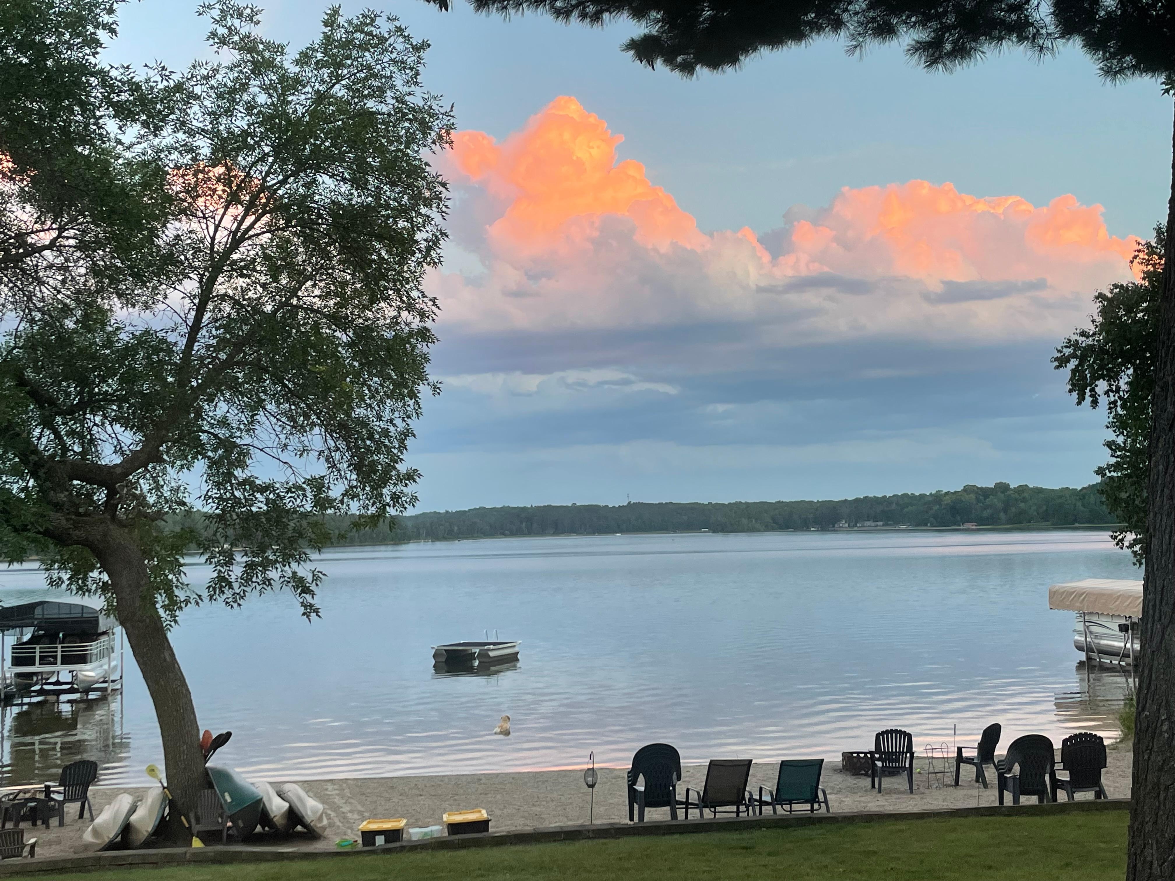 Evening clouds at sunset and Darby dog enjoying the water❤️