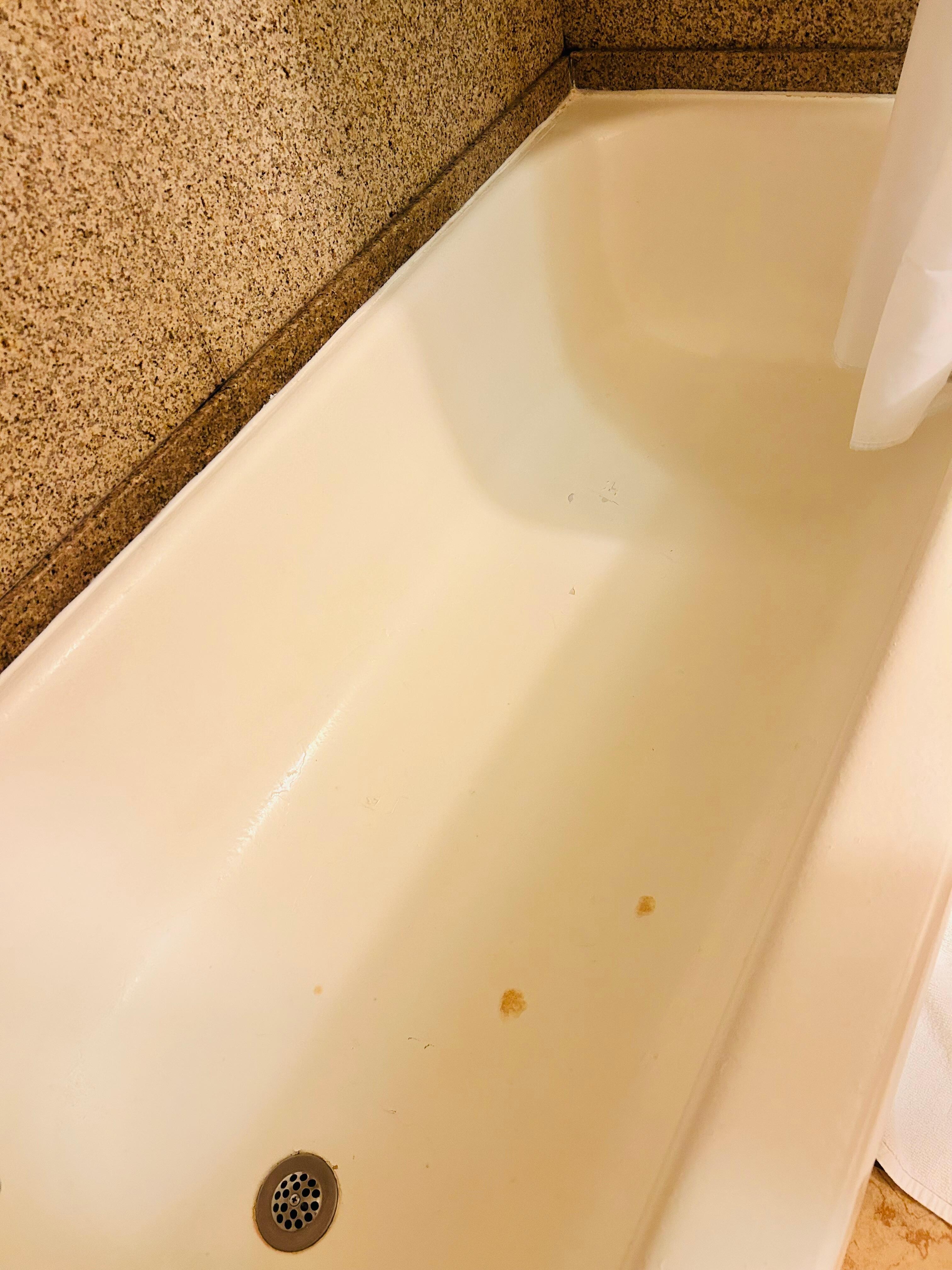 Mold in corner, cigarette burns on floor