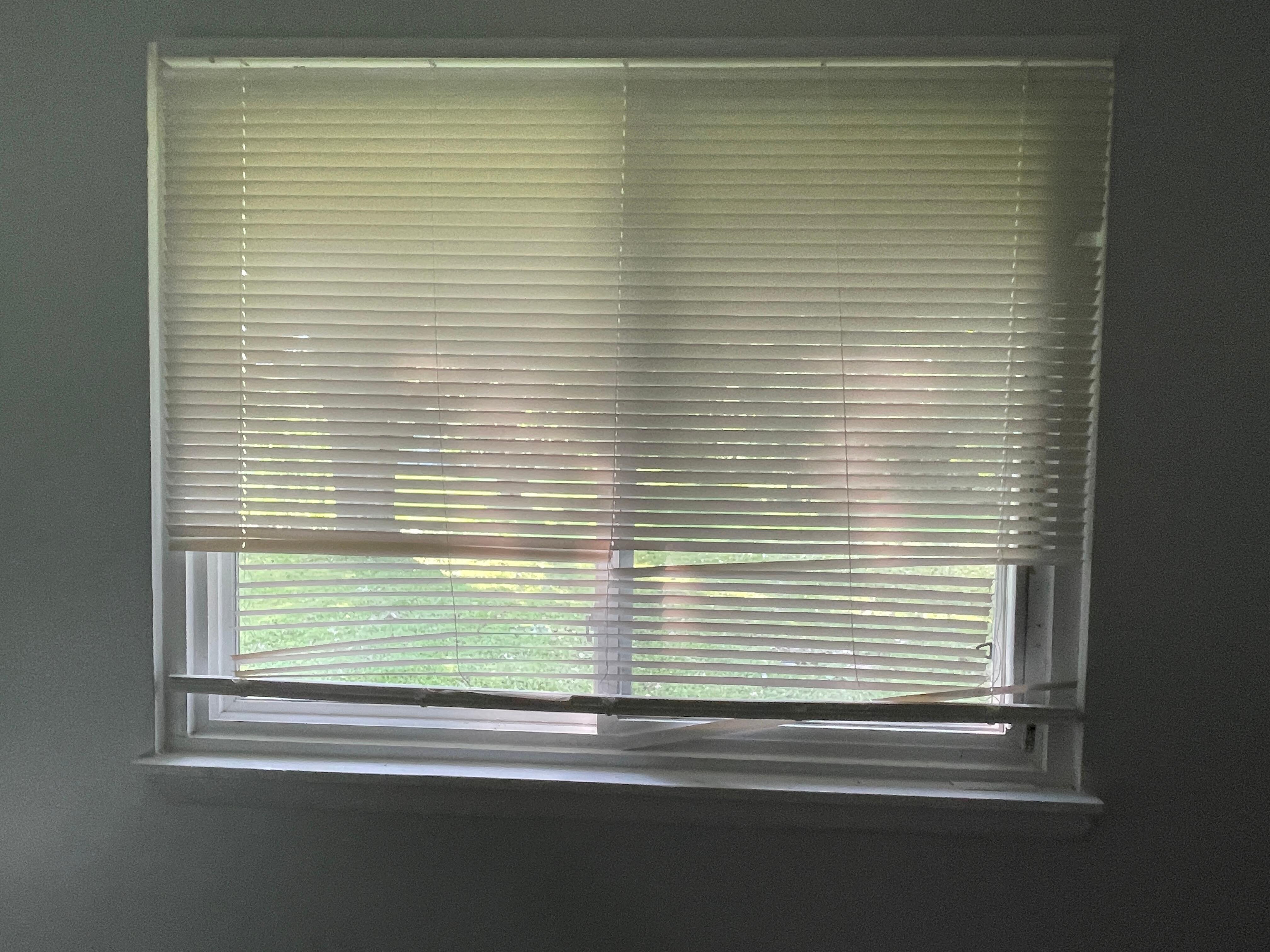 Broken blinds in kitchen