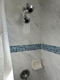 2 shower heads ?
Not enough pressure for even one!