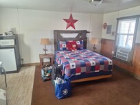 One of the separate bedrooms which also had a table, chairs, fridge and microwave.