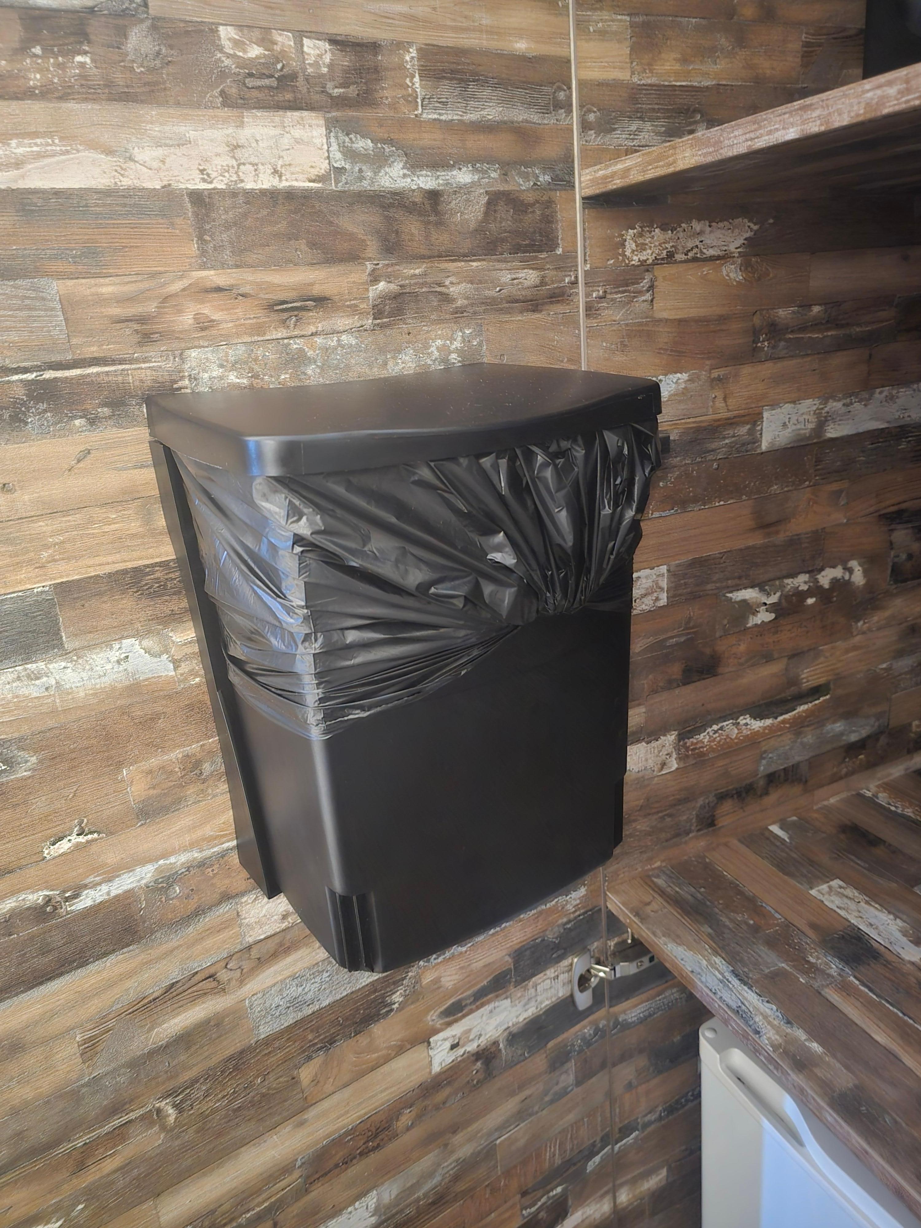 In closed cabinet with fridge and safe