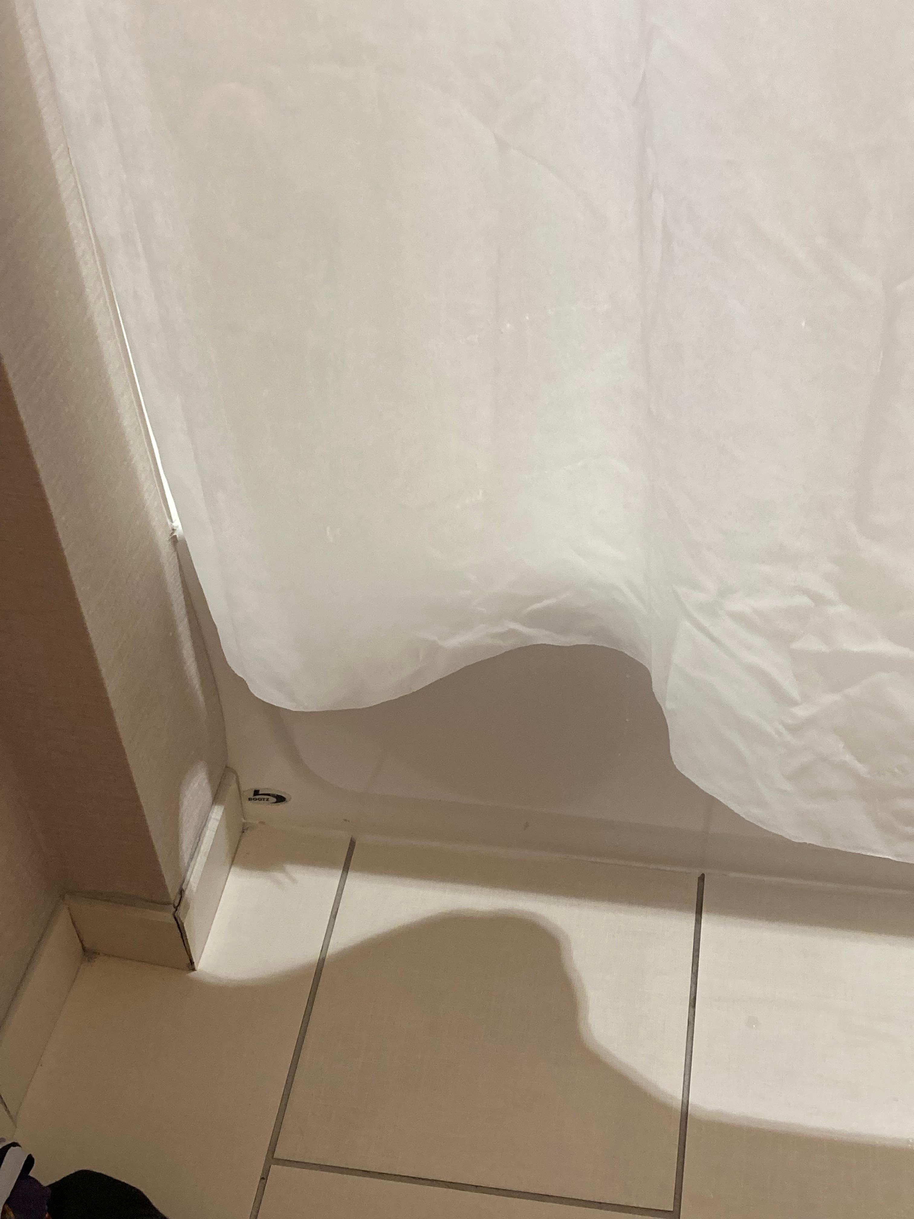 The shower curtain wouldn’t stay inside the shower, it’s hung too high so when I stepped  out, hella water on the floor. 