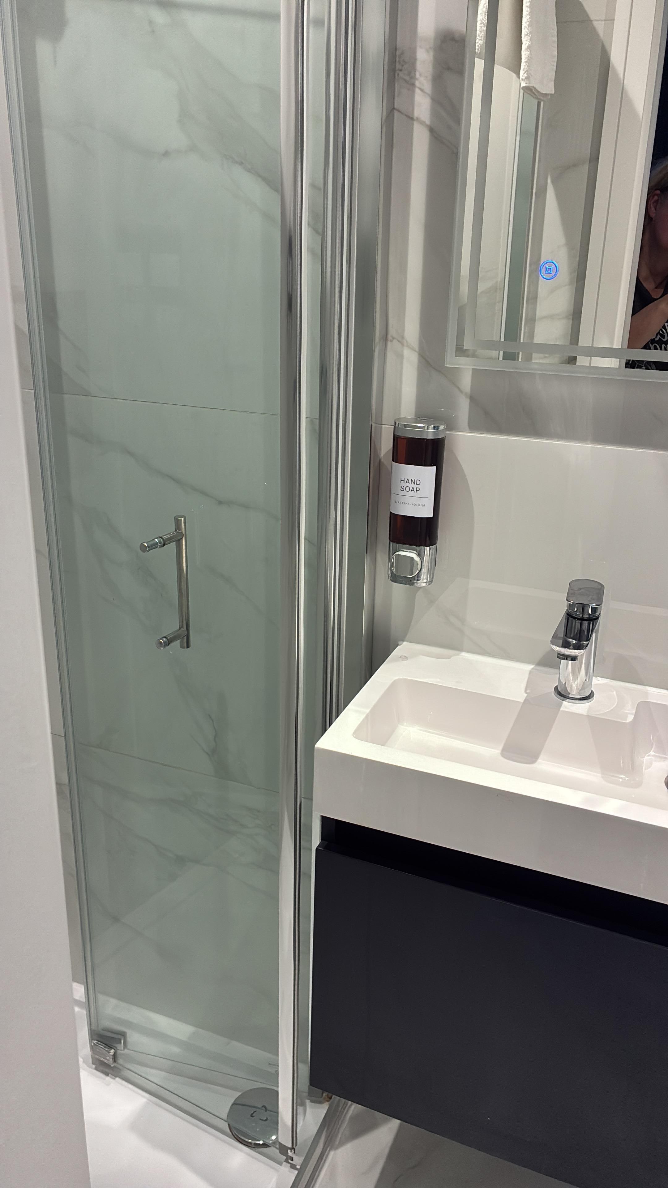 Walk-in shower with toiletries