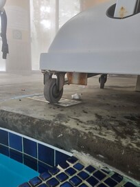 The handicap lift with a tampon and cigarette bud under it.