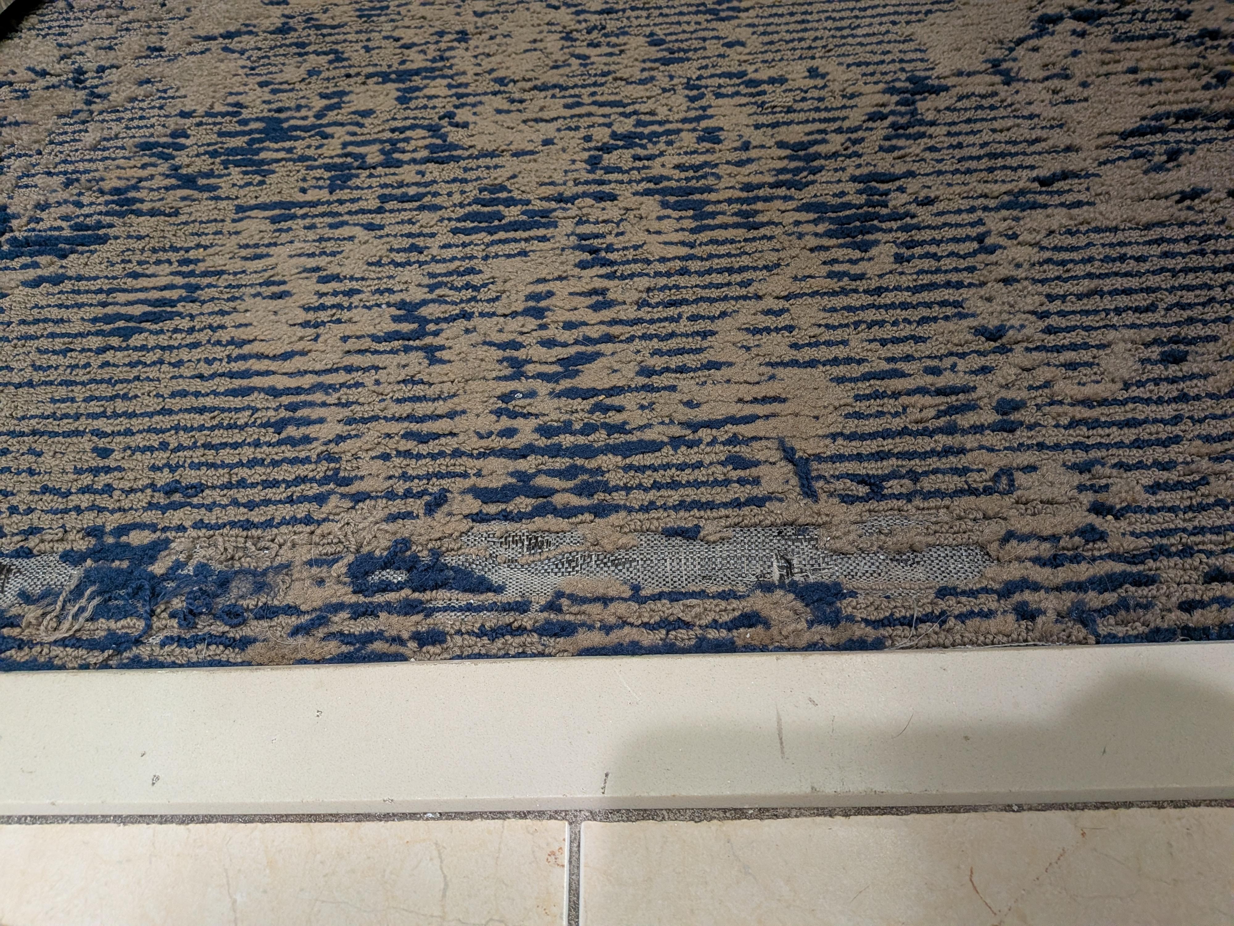 Torn/worn out carpet