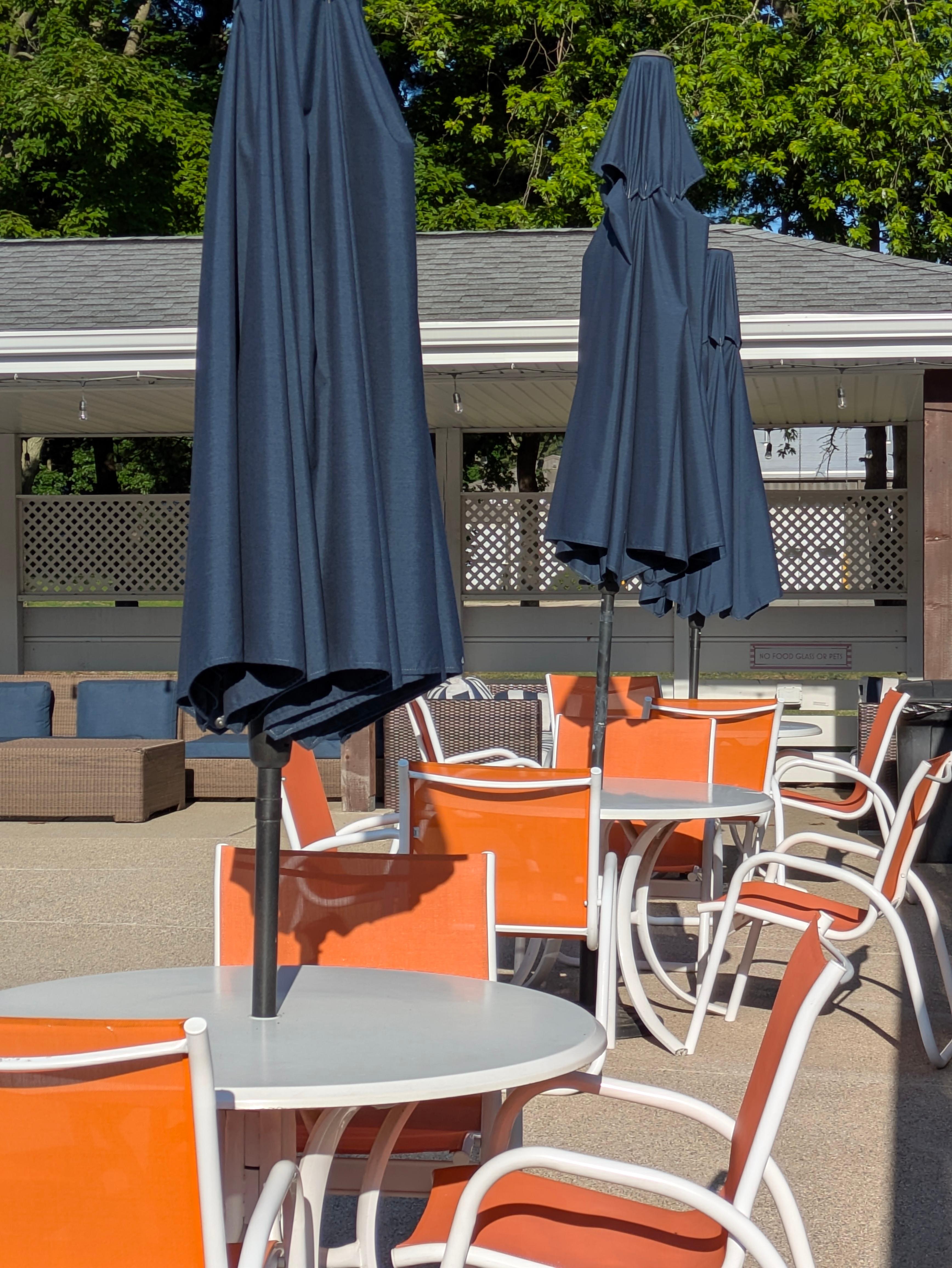 The pool area includes seating in sun and shade.