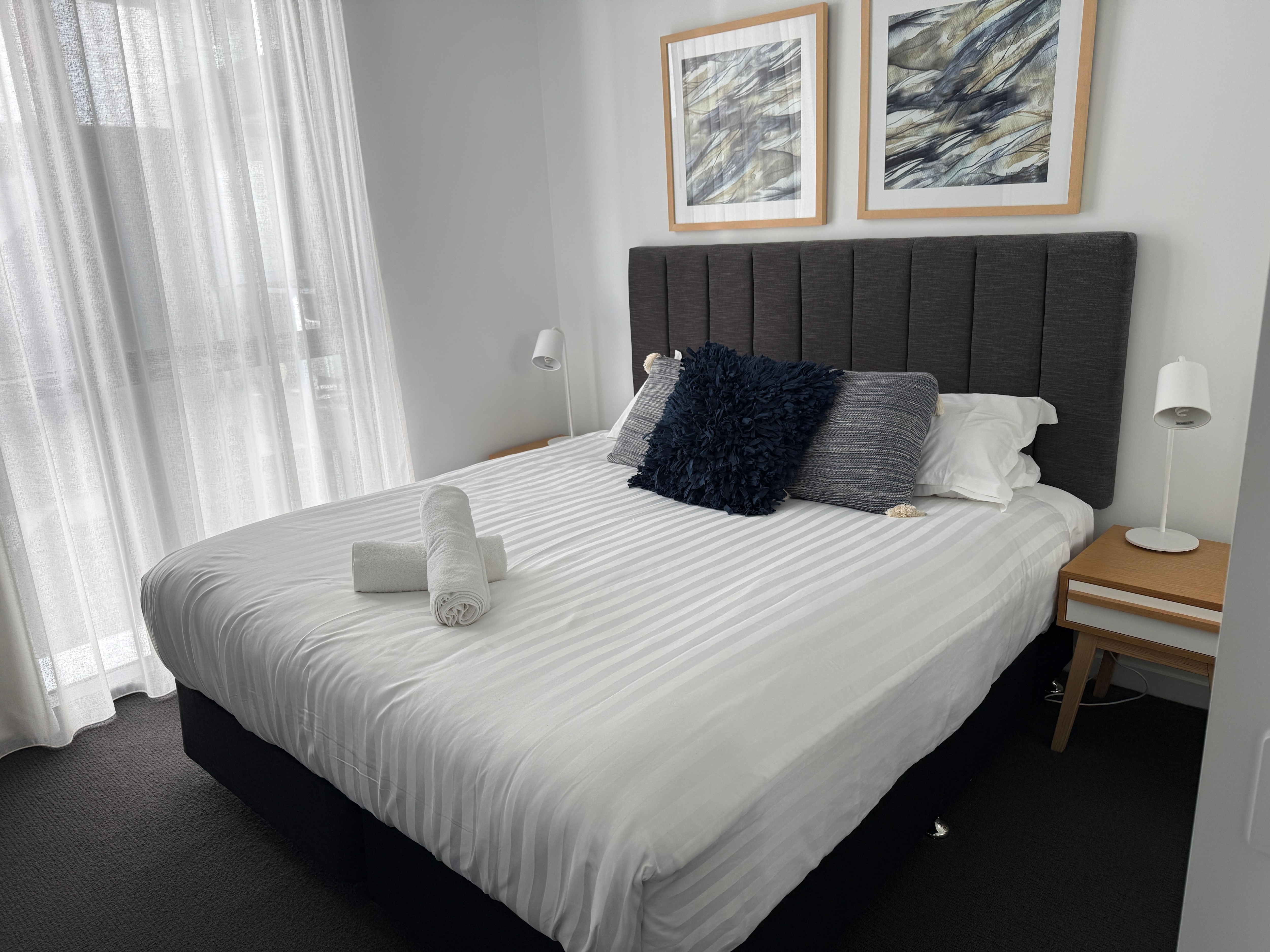 Master bedroom- 1 hand towel without a holder and 2 shower towels- told we needed to buy washcloths if wanted; bed extremely bouncy not high quality 