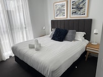 Master bedroom- 1 hand towel without a holder and 2 shower towels- told we needed to buy washcloths if wanted; bed extremely bouncy not high quality