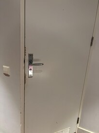 Dirt on the bathroom door.