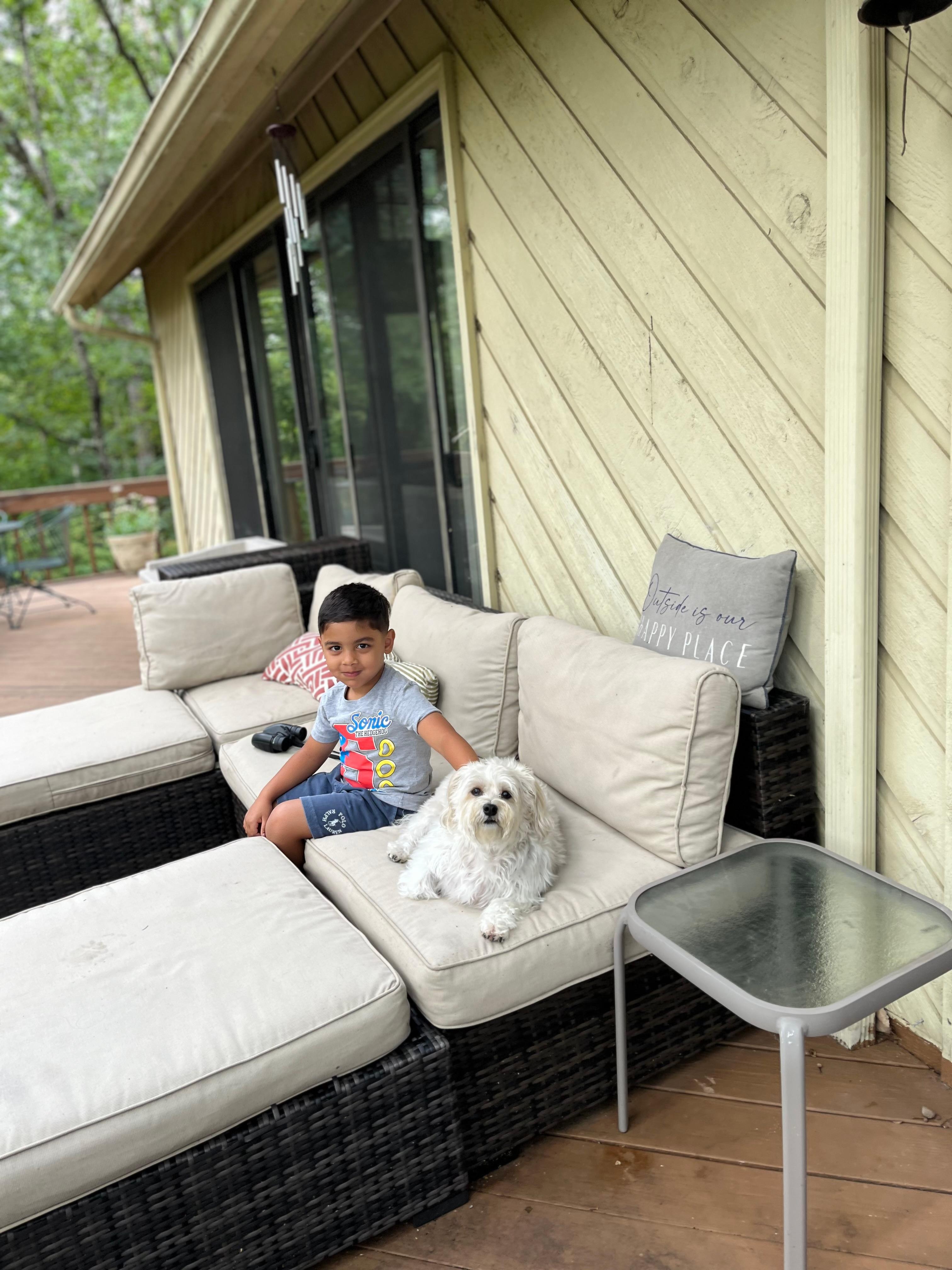 My grandson and my baby Daisy enjoying the patio.