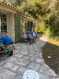 My mum relaxing on one of the gorgeous shady terraces