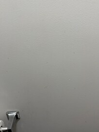 Stains on bathroom wall (these covered every wall in the bathroom)