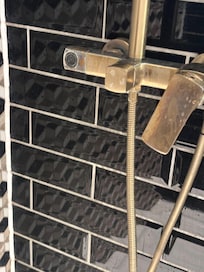 Damaged shower that missed a hose so just squirted out at you.