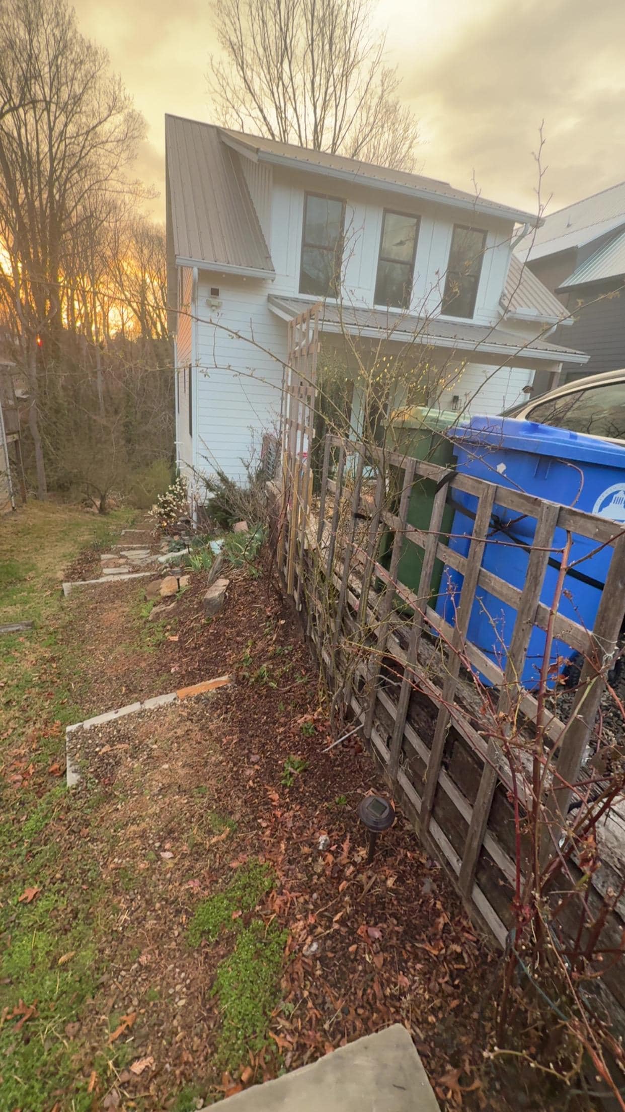 Access to place is down the steps and on the back patio. 