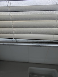 Blinds covered in dust