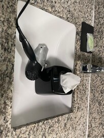 Hair dryer and tissues in sink