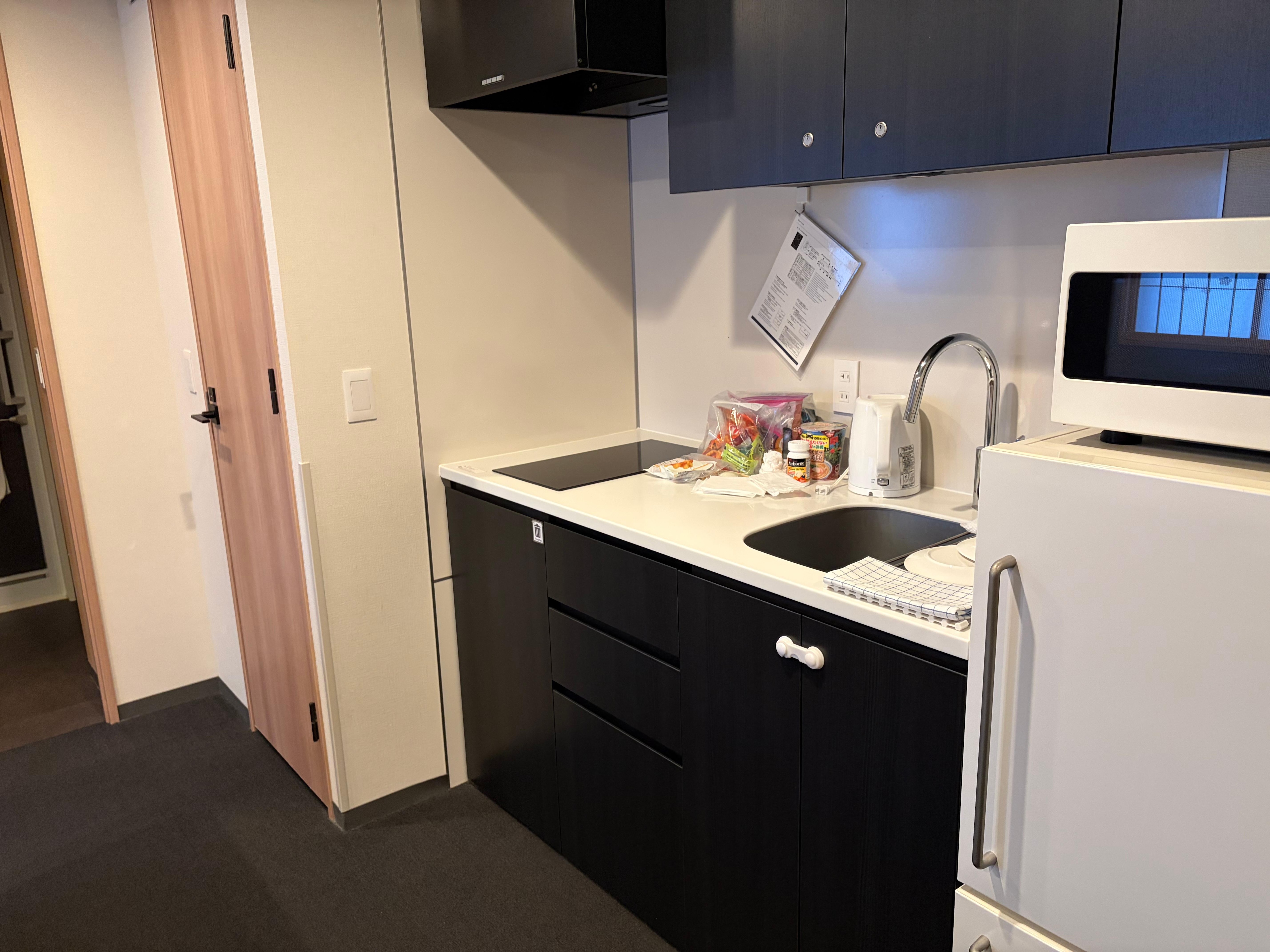 Stove, microwave and fridge. 