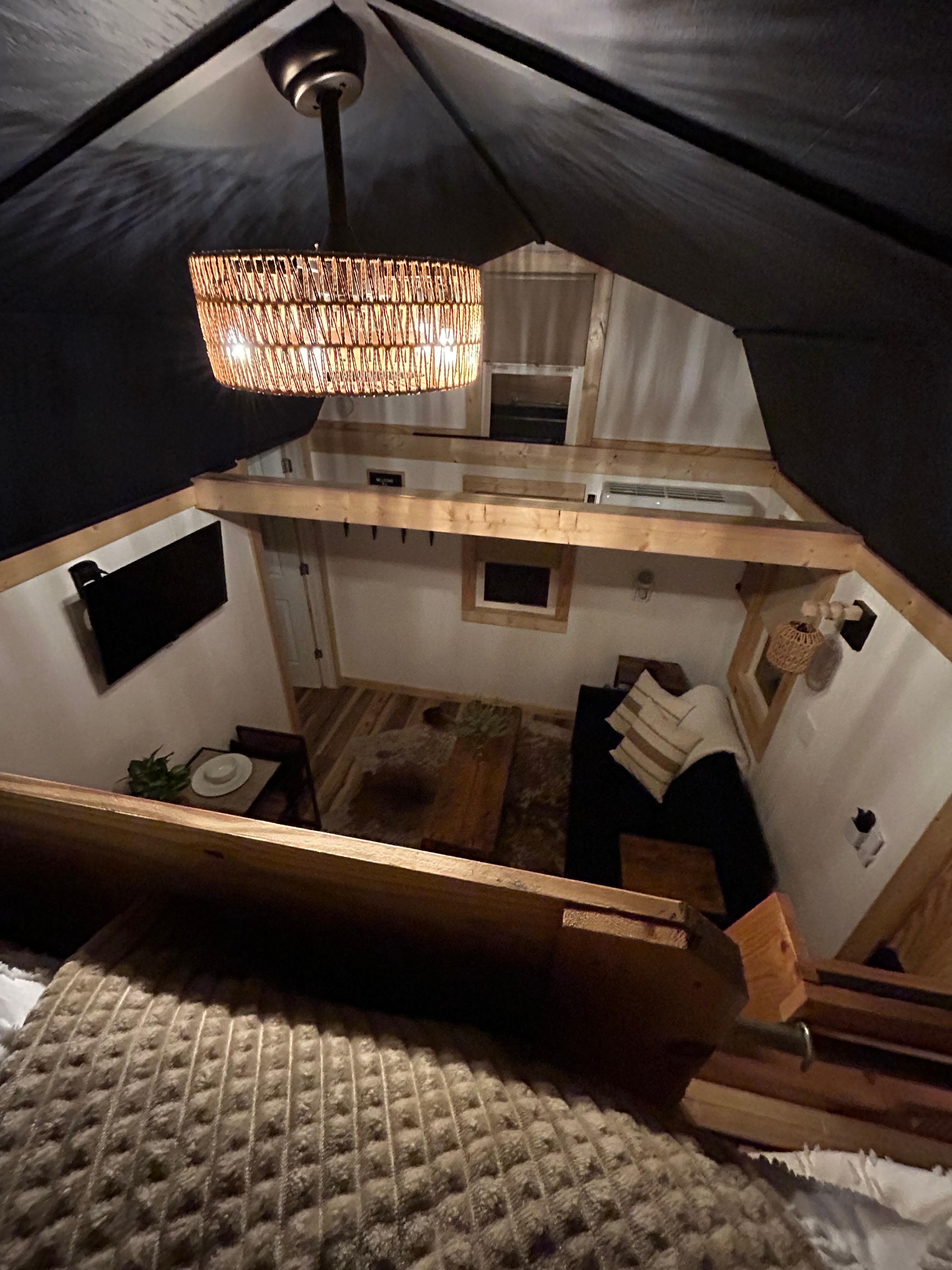 View of living space from the loft. Plenty of airflow from fan and A/C below. 