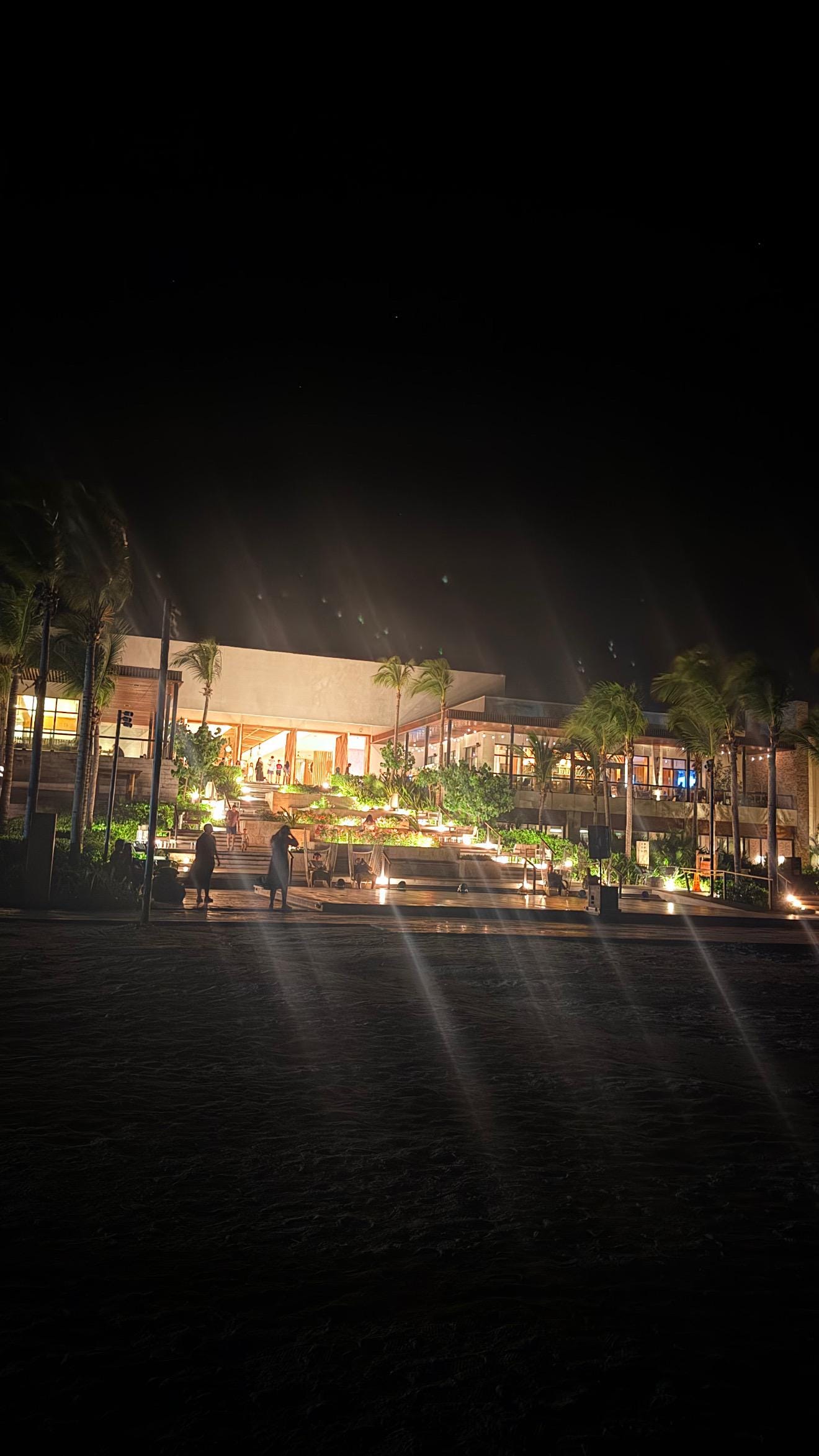 Outside on the sand by the Carribian Sea facing the Hilton