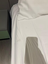 Multiple stains on the bed