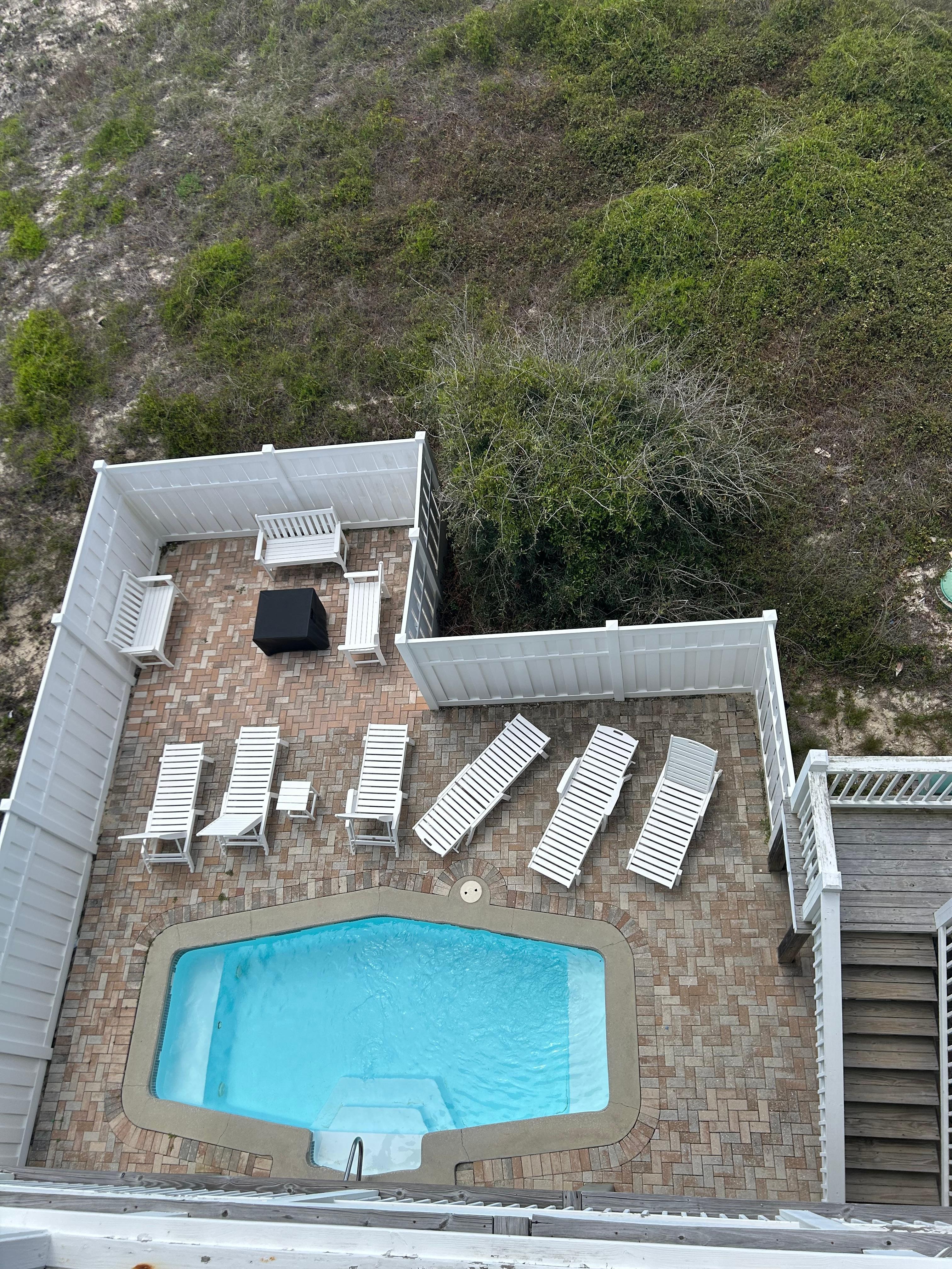 Pool and fire pit area from upper deck. You can’t see great sitting area underneath.