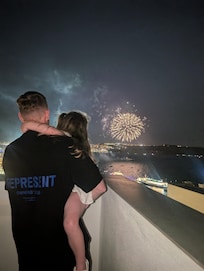 Watching the festival of our lady of sorrows fireworks from the rooftop area.